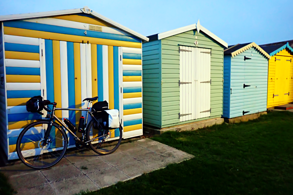 George's bike leaning against a beach hut